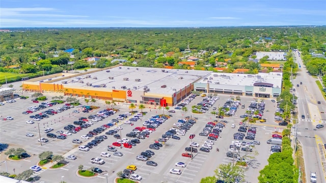 aerial view of a commercial area and a heavily wooded area