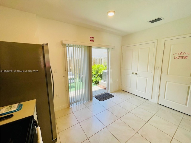 448 NE 4th St, Florida City, FL 33034 - doorway featuring light tile patterned flooring and recessed lighting