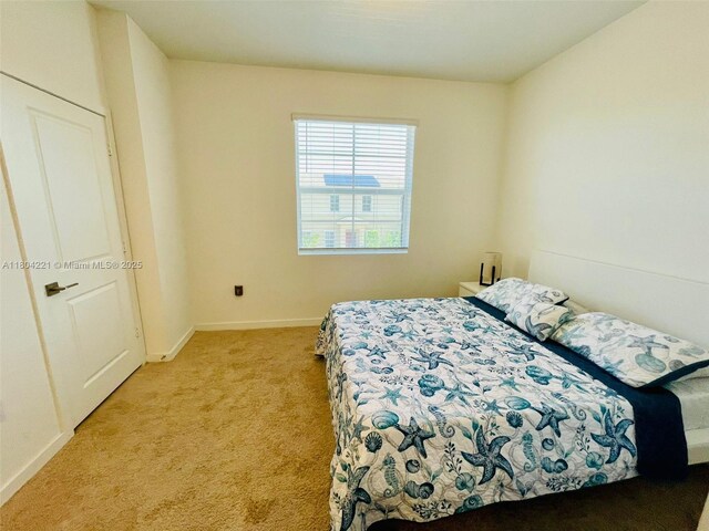 448 NE 4th St, Florida City, FL 33034 - bedroom featuring light colored carpet and baseboards