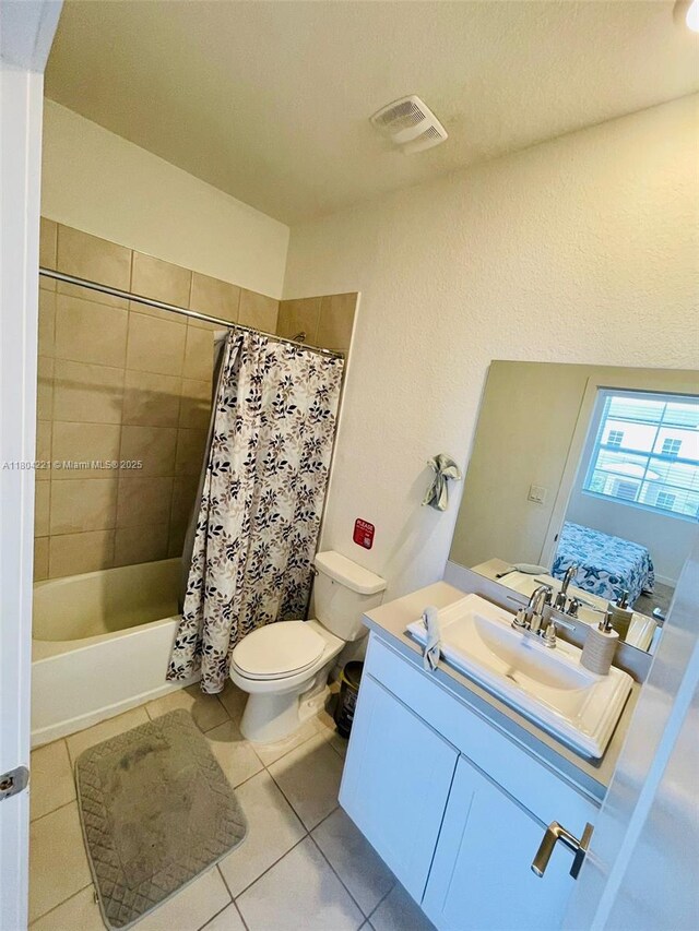 448 NE 4th St, Florida City, FL 33034 - full bath with tile patterned flooring, toilet, vanity, and shower / bath combination with curtain