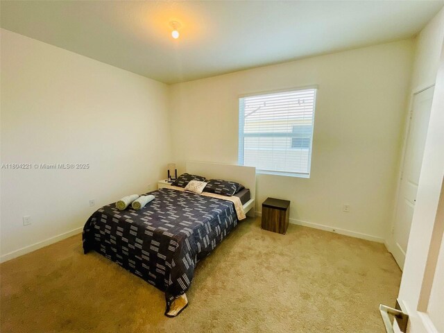 448 NE 4th St, Florida City, FL 33034 - carpeted bedroom featuring baseboards