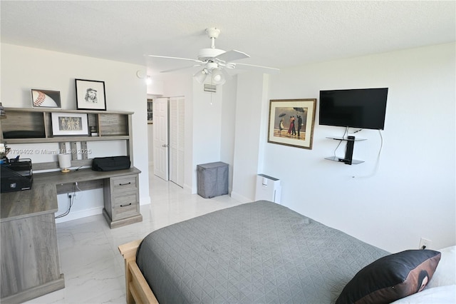 947 Lenox Ave Unit 504, Miami Beach, FL 33139 - bedroom featuring an office area, marble finish floors, a ceiling fan, and a closet