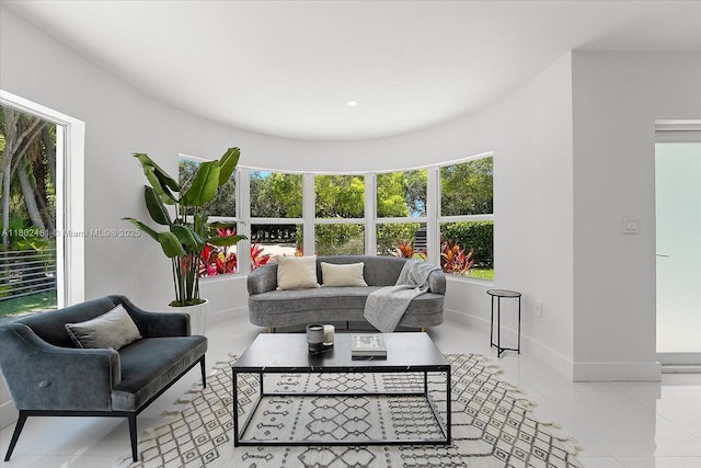 3020 Alton Rd, Miami Beach, FL 33140 - living room featuring plenty of natural light, baseboards, and tile patterned flooring
