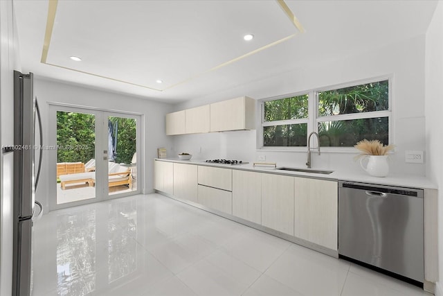 3020 Alton Rd, Miami Beach, FL 33140 - kitchen with stainless steel appliances, a sink, modern cabinets, light countertops, and recessed lighting