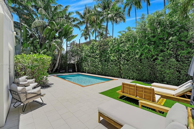 3020 Alton Rd, Miami Beach, FL 33140 - outdoor pool featuring an outdoor hangout area and a patio