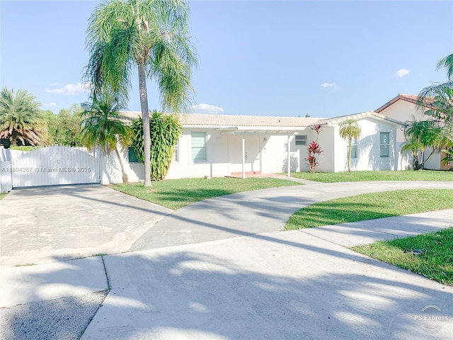 3321 SW 110th Ave, Miami, FL 33165 - ranch-style house with curved driveway, a tile roof, stucco siding, and a gate