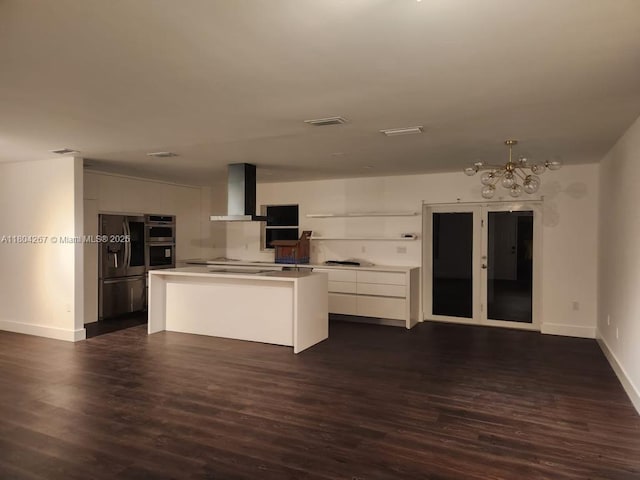 3321 SW 110th Ave, Miami, FL 33165 - kitchen featuring wall chimney range hood, stainless steel appliances, a chandelier, and dark wood-style floors