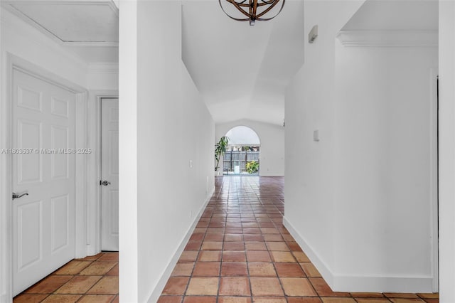 1903 SW 180th Ter, Miramar, FL 33029 - corridor featuring baseboards, lofted ceiling, and arched walkways