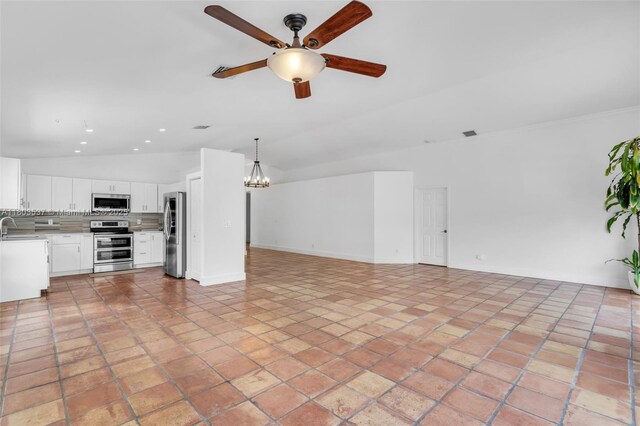 1903 SW 180th Ter, Miramar, FL 33029 - unfurnished living room with a ceiling fan, a sink, a chandelier, vaulted ceiling, and recessed lighting