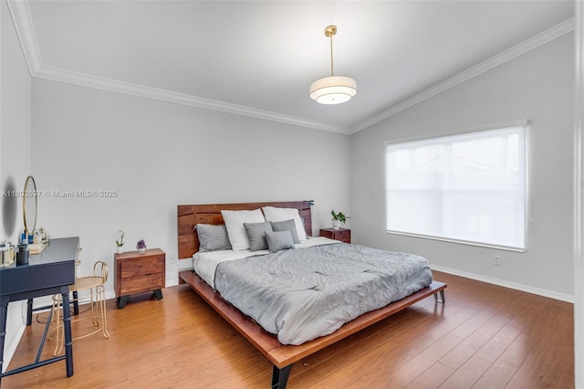 1903 SW 180th Ter, Miramar, FL 33029 - bedroom featuring wood finished floors, vaulted ceiling, crown molding, and baseboards