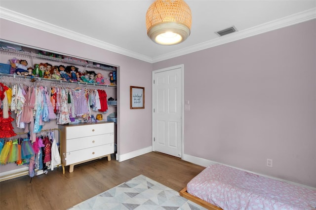 1903 SW 180th Ter, Miramar, FL 33029 - bedroom featuring crown molding, wood finished floors, baseboards, and a closet