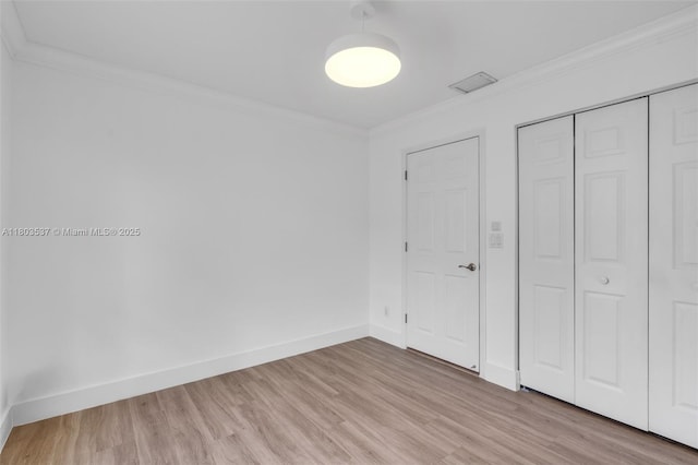 1903 SW 180th Ter, Miramar, FL 33029 - unfurnished bedroom featuring ornamental molding, baseboards, light wood-type flooring, and a closet