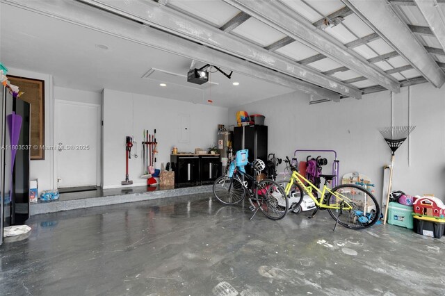 1903 SW 180th Ter, Miramar, FL 33029 - garage featuring a garage door opener and water heater
