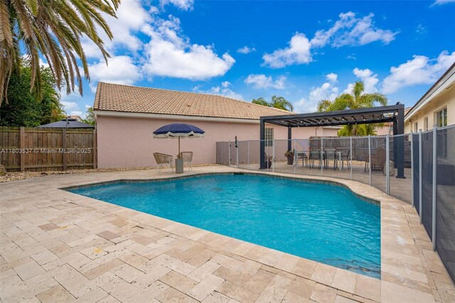 1903 SW 180th Ter, Miramar, FL 33029 - view of swimming pool with a pergola, a patio area, and a fenced backyard