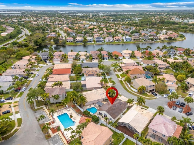 1903 SW 180th Ter, Miramar, FL 33029 - aerial overview of property's location with nearby suburban area, a large body of water, and a pool