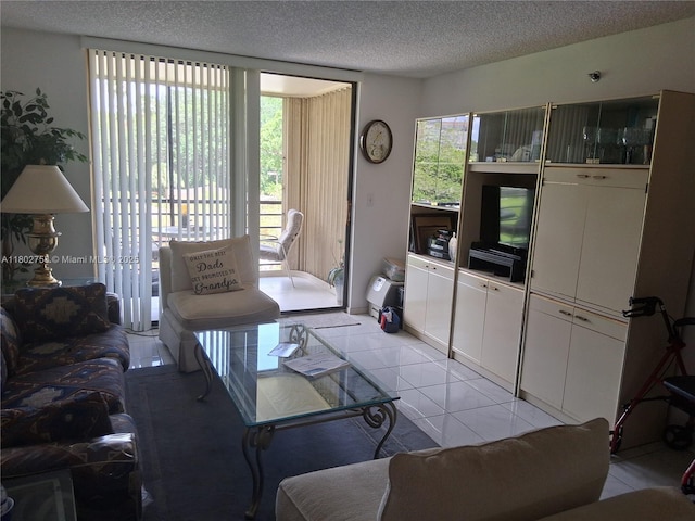 1300 Saint Charles Pl Unit 302, Pembroke Pines, FL 33026 - living area featuring a textured ceiling and light tile patterned floors