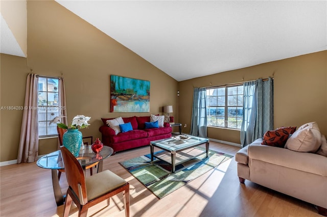 9465 SW 146th Ct, Miami, FL 33186 - living room with light wood-style floors, high vaulted ceiling, and baseboards