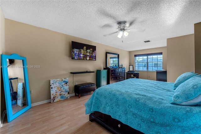 9465 SW 146th Ct, Miami, FL 33186 - bedroom featuring wood finished floors, a textured ceiling, ceiling fan, and baseboards