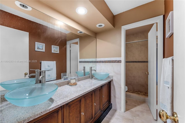 9465 SW 146th Ct, Miami, FL 33186 - full bath featuring double vanity, a shower stall, tile patterned floors, and tile walls