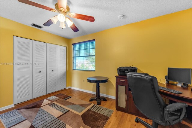 9465 SW 146th Ct, Miami, FL 33186 - office space with ceiling fan, wood finished floors, baseboards, and a textured ceiling