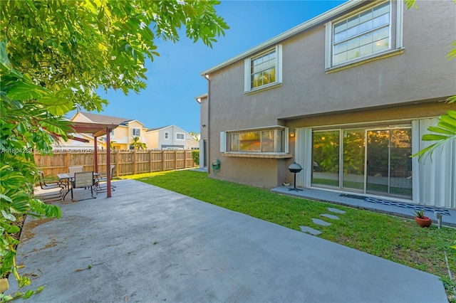 9465 SW 146th Ct, Miami, FL 33186 - back of house with a patio, stucco siding, outdoor dining area, and a residential view