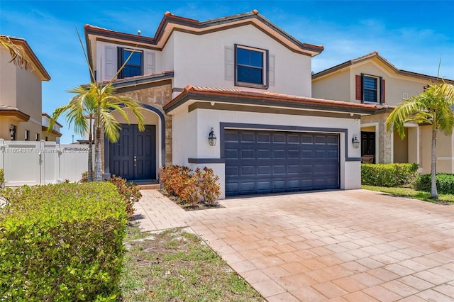 3531 W 104th Ter, Hialeah, FL 33018 - view of front of home featuring stucco siding, an attached garage, decorative driveway, and a gate