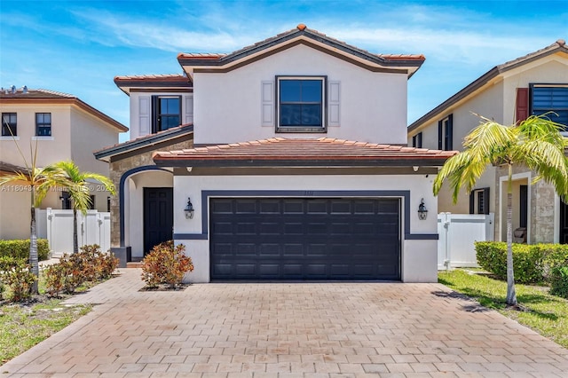 3531 W 104th Ter, Hialeah, FL 33018 - mediterranean / spanish home featuring a tile roof, a garage, and stucco siding