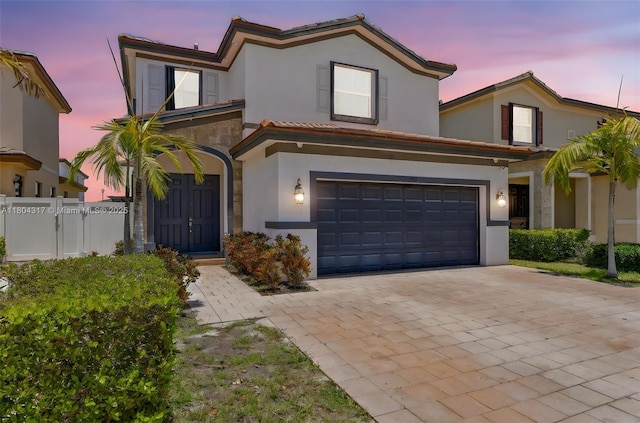 3531 W 104th Ter, Hialeah, FL 33018 - view of front of house with stucco siding, an attached garage, decorative driveway, and a tile roof