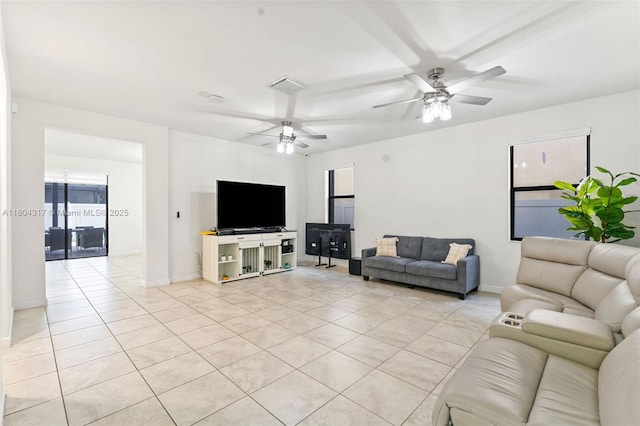 3531 W 104th Ter, Hialeah, FL 33018 - living room with light tile patterned flooring, a ceiling fan, and baseboards