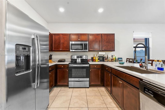 3531 W 104th Ter, Hialeah, FL 33018 - kitchen featuring appliances with stainless steel finishes, a sink, light countertops, light tile patterned floors, and recessed lighting