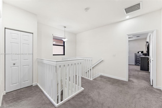 3531 W 104th Ter, Hialeah, FL 33018 - hall with an upstairs landing, carpet floors, and baseboards