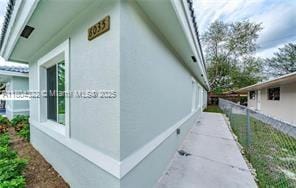 6035 SW 40th Ct, Miramar, FL 33023 - view of side of home with fence and stucco siding