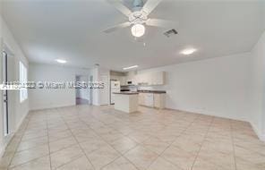 6035 SW 40th Ct, Miramar, FL 33023 - unfurnished living room featuring ceiling fan and light tile patterned floors