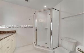 6035 SW 40th Ct, Miramar, FL 33023 - bathroom featuring a shower stall, toilet, vanity, and recessed lighting