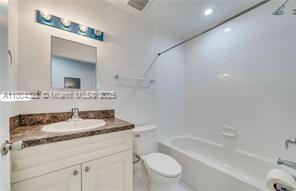 6035 SW 40th Ct, Miramar, FL 33023 - bathroom featuring toilet, shower / bathtub combination, and vanity