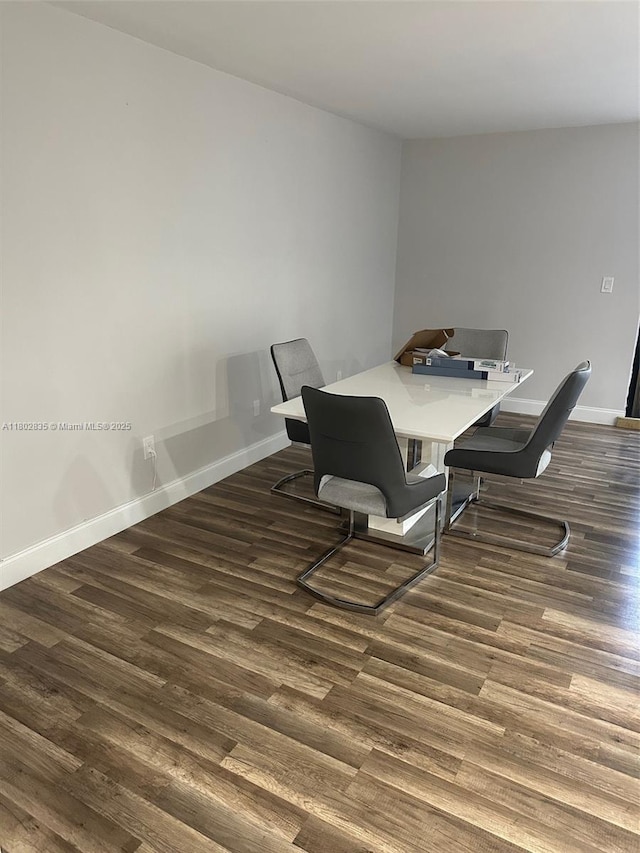 685 NE 206th Ter, Miami, FL 33179 - dining area featuring dark wood finished floors and baseboards