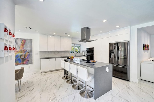 626 S 13th Ave, Hollywood, FL 33019 - kitchen featuring black appliances, island exhaust hood, modern cabinets, dark countertops, and white cabinetry
