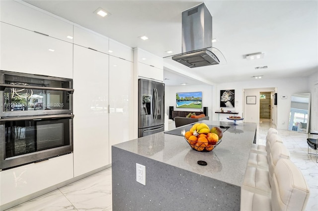 626 S 13th Ave, Hollywood, FL 33019 - kitchen with stainless steel refrigerator with ice dispenser, island range hood, light marble finish floors, double oven, and modern cabinets