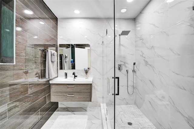 626 S 13th Ave, Hollywood, FL 33019 - full bath with a marble finish shower, vanity, recessed lighting, marble finish flooring, and tile walls