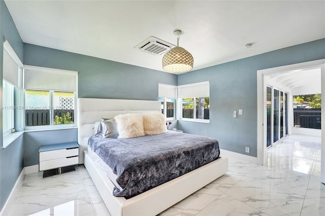 626 S 13th Ave, Hollywood, FL 33019 - bedroom with marble look tiles, multiple windows, and baseboards
