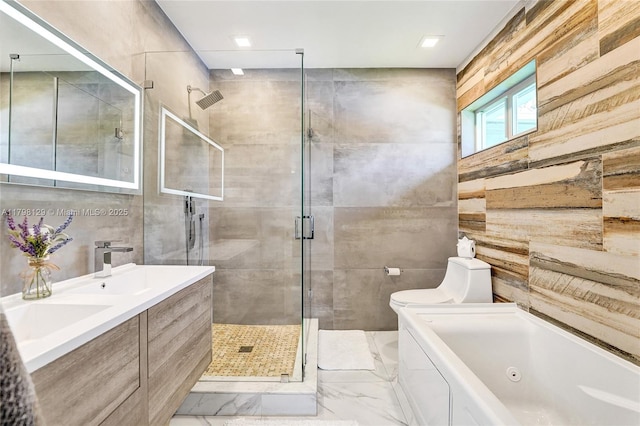 626 S 13th Ave, Hollywood, FL 33019 - bathroom with marble finish floors, a stall shower, a bath, tile walls, and toilet