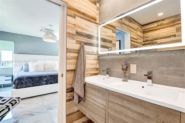 626 S 13th Ave, Hollywood, FL 33019 - full bath with ensuite bath, marble finish flooring, wooden walls, and double vanity