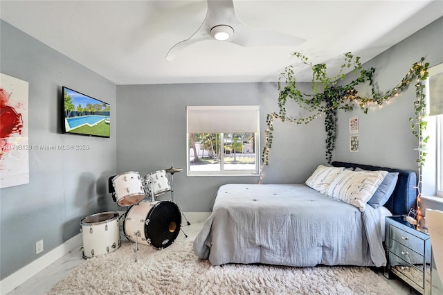 626 S 13th Ave, Hollywood, FL 33019 - bedroom featuring marble look tiles, multiple windows, and baseboards