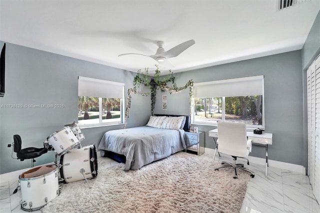 626 S 13th Ave, Hollywood, FL 33019 - bedroom featuring marble look tiles, ceiling fan, and a desk