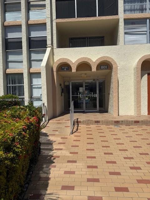 801 Three Islands Blvd Unit 302, Hallandale Beach, FL 33009 - entrance to property featuring stucco siding and french doors