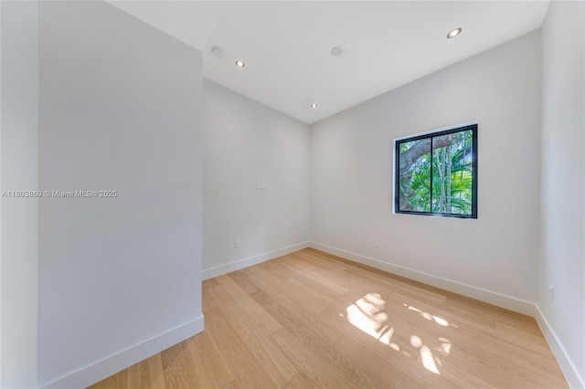 1000 NW 9th Ct, Miami, FL 33136 - unfurnished room featuring baseboards, light wood-style floors, and recessed lighting