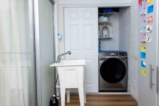 2541 Boundbrook Blvd Unit 122, Palm Springs, FL 33406 - washroom with washer / clothes dryer and wood finished floors