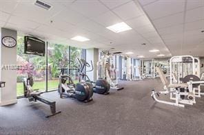 540 Brickell Key Dr Unit 302, Miami, FL 33131 - workout area with a wall of windows and a drop ceiling