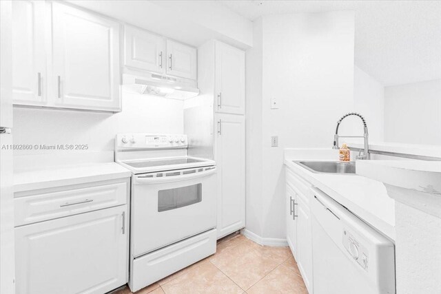 3420 N Pinewalk Dr N Unit 713, Margate, FL 33063 - kitchen with white appliances, under cabinet range hood, a sink, and white cabinets