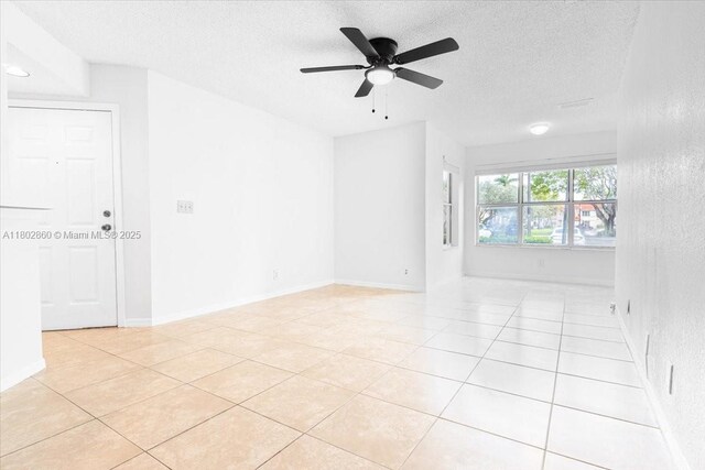 3420 N Pinewalk Dr N Unit 713, Margate, FL 33063 - spare room with a textured ceiling, light tile patterned floors, and ceiling fan